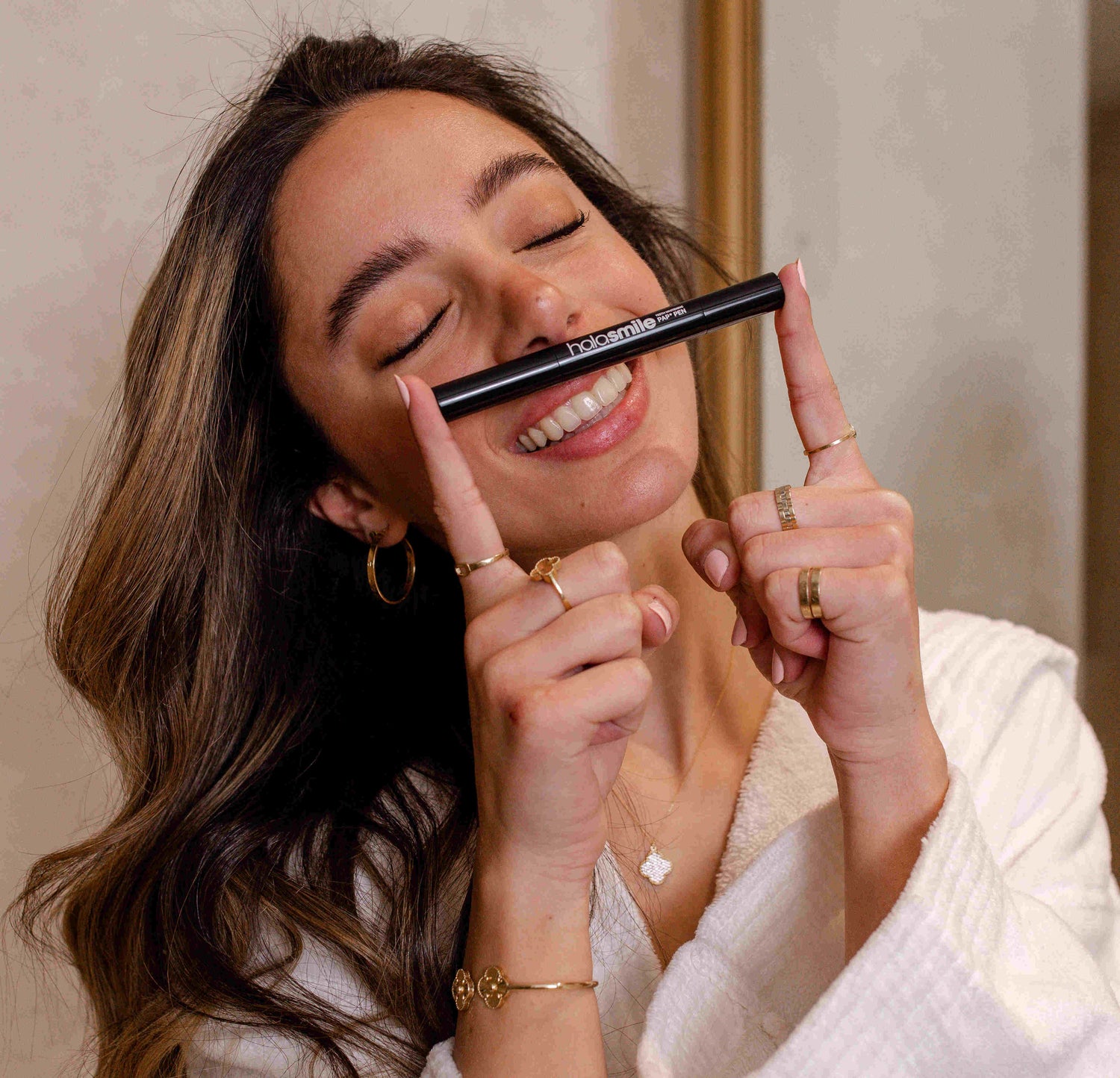 image of girl happy with the results of the teeth whitening pen